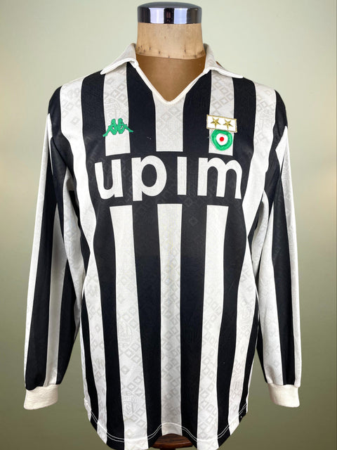 Black and white striped Kappa Juventus 1990-91 jersey with Upim branding on a mannequin against a neutral background