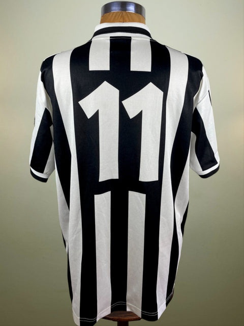 A black and white striped 1994-95 match worn Fabrizio Ravanelli short sleeved jersey with number 11 printed into the shirt fabric.