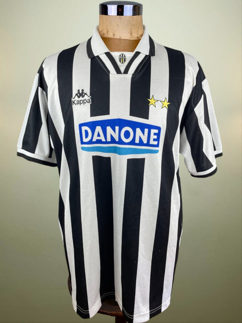 A black and white striped 1994-95 match worn Fabrizio Ravanelli short sleeved jersey with a Danone sponsor logo, displayed on a mannequin.