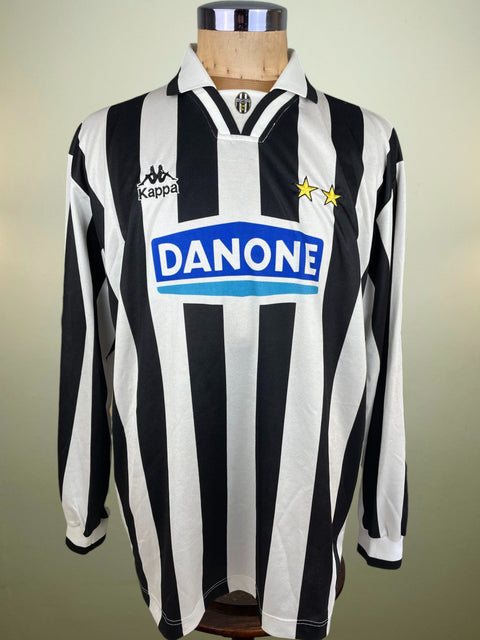 Black and white striped match worn Fabrizio Ravanelli Juventus jersey from the 1994-95 season with Danone logo on a mannequin against a neutral background
