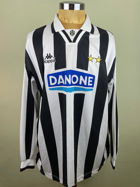 A black and white striped 1994-95 match worn Ciro Ferrara long sleeved jersey with a Danone sponsor logo, displayed on a mannequin.