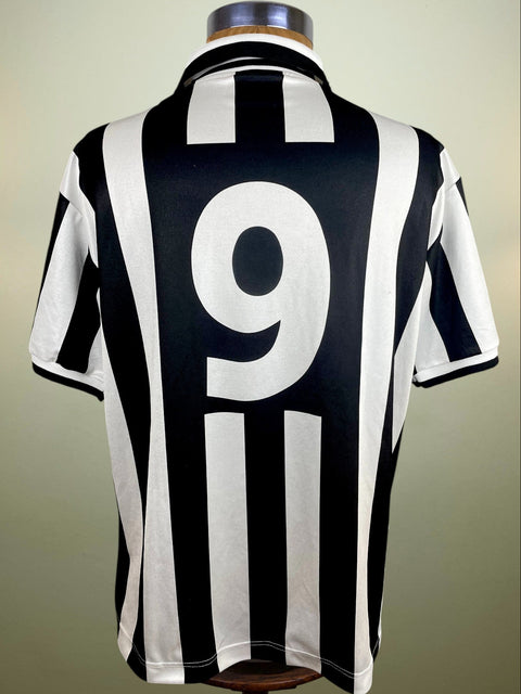 A black and white striped 1994-95 match worn Gianluca Vialli short sleeved jersey with number 9 printed into the fabric of the shirt, displayed on a mannequin.