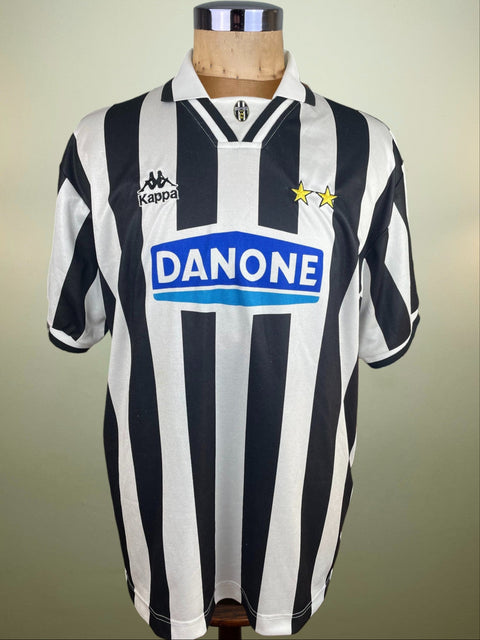 Black and white striped Juventus match worn Gianluca Vialli 1994-95 jersey with Kappa and Danone logos on a mannequin against a beige background