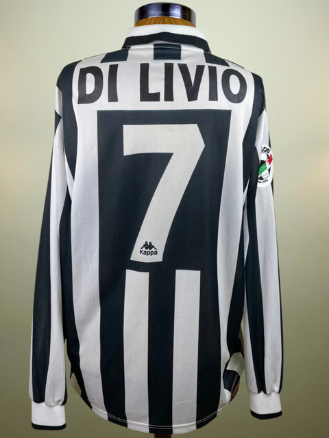 A match worn 1996-97 Juventus long sleeve home jersey in black and white, made by Kappa with Di Livio 7 printed into the fabric of the shirt.