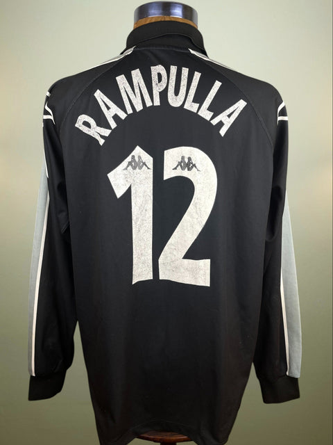 Black Juventus 1996-97 goalkeeper jersey with 'Rampulla' and number '12' on the back in light plastic on a mannequin against a neutral background