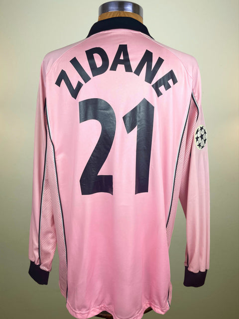 Pink Juventus Centenary match prepared Zinedine Zidane jersey with 'Zidane' and number '21' and the Champions League patch on the arm. On a mannequin against a beige background