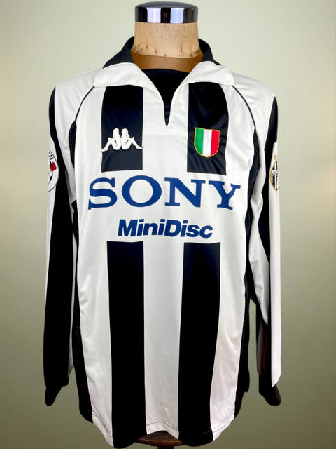 A match worn Zinedine Zidane Juventus 1997-98 home jersey with long sleeves, predominantly white with black stripes, with Sony Minidisc sponsor and Serie A patch heatpressed onto the arm