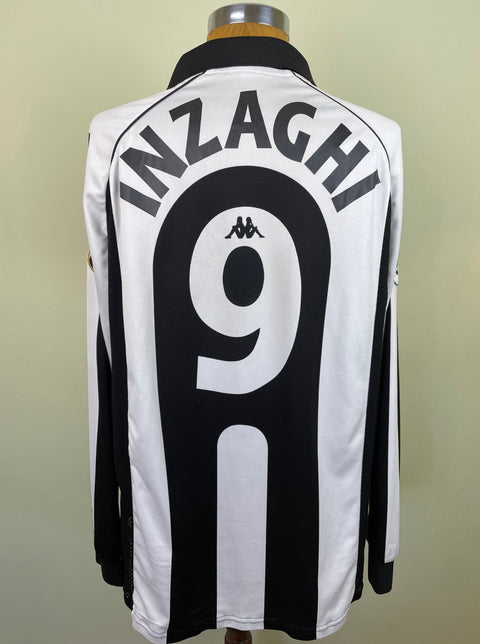 A black and white striped Juventus match worn home jersey with the name 'INZAGHI' and the number '9' on the back, displayed on a mannequin.