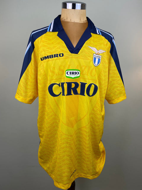 Match worn yellow short sleeve Lazio away shirt from the 1996-97 season worn by Pierluigi Casiraghi with Cirio Sponsor in black flock across the front of the shirt. Made by Umbro.