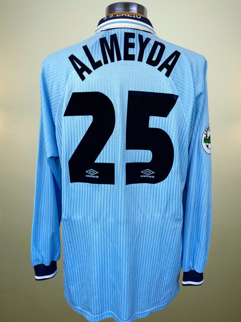 Light blue Lazio 1997 Home jersey with 'Almeyda' and number '25' on a beige background