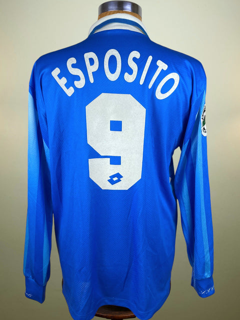 Blue Napoli Lotto 1996-97 jersey with 'ESPOSITO' and number '9' on a mannequin against a beige background