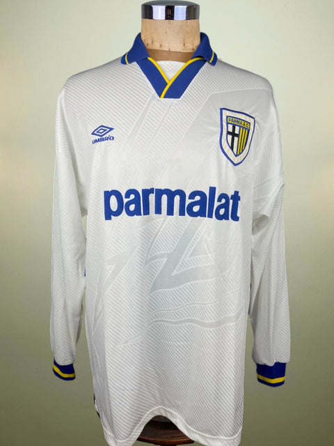 Match worn White Fernando Couto long sleeve Parma home shirt from the 1994-95 season, with Parmalat sponsor in blue flock across the chest. Made by Umbro.