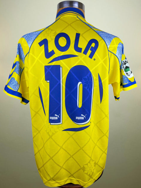 Yellow Parma Away jersey with blue number 10 and Zola written in the fabric of the shirt on a mannequin against a neutral background