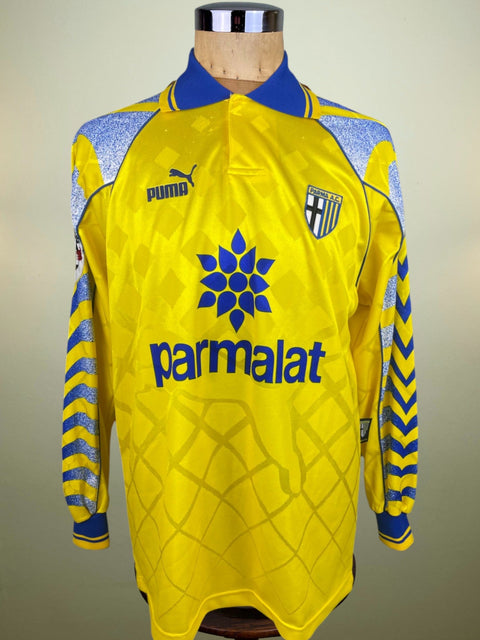 Match worn yellow Massimo Crippa Parma long sleeve home shirt from the 1996-97 season, with Parmalat sponsor across the chest in the fabric of the shirt. Made by Puma.