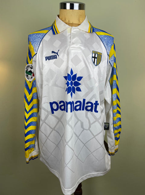 Match worn white Antonio Benarrivo Parma long sleeve home shirt from the 1996-97 season, with Parmalat sponsor across the chest in the fabric of the shirt. Made by Puma.