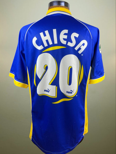 Match worn blue Enrico Chiesa Parma short sleeve away shirt from the 1997-98 season, with name and number 20 in the fabric of the shirt. Made by Puma.