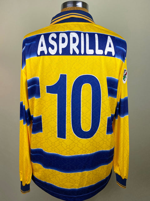 Match worn yellow Faustino Asprilla Parma long sleeve home shirt from the 1998-99 season, with name and number 10 in the fabric of the shirt. Made by Lotto.