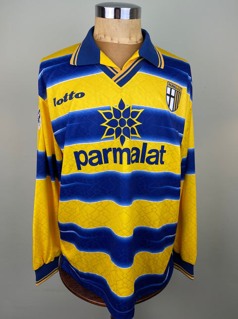 Match worn yellow Faustino Asprilla Parma long sleeve home shirt from the 1998-99 season, with Parmalat sponsor across the chest in the fabric of the shirt. Made by Lotto.