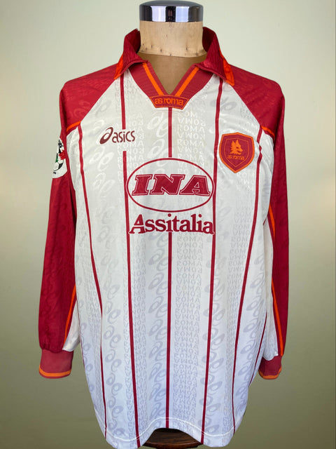 White AS Roma away jersey with red accents and Ina Assitalia sponsor on a mannequin against a plain background