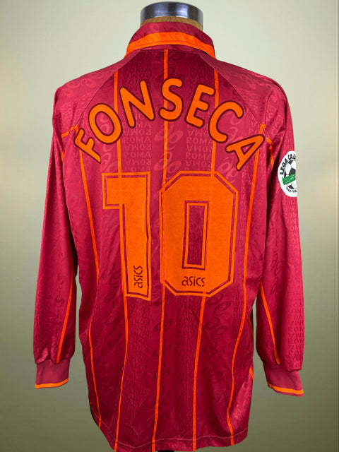 Red AS Roma 1996-97 long sleeved home jersey with 'FONSECA 16' printed on a mannequin against a beige background