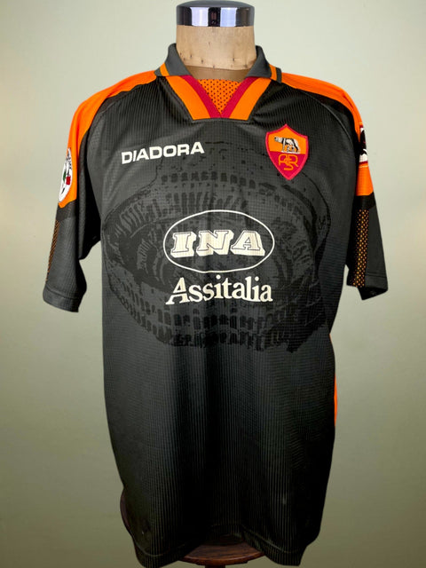 Black AS Roma 1997/98 third shirt, short sleeves, INA Assitalia sponsor across the chest. Match-worn by Francesco Totti. Diadora logo.