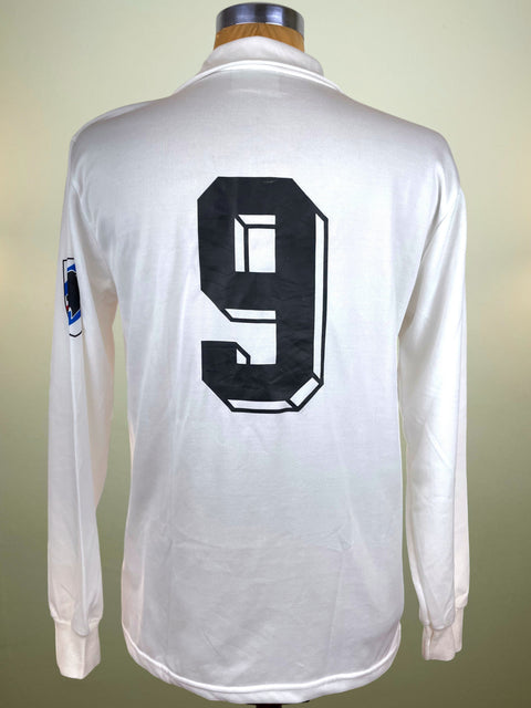 White long-sleeve shirt with number 9 on a mannequin against a neutral background