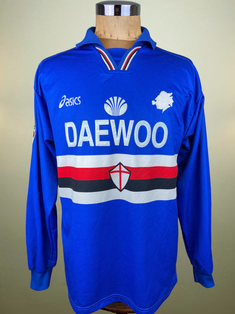 Blue Sampdoria 1997 jersey with Daewoo branding and made by Asics on a mannequin against a beige background