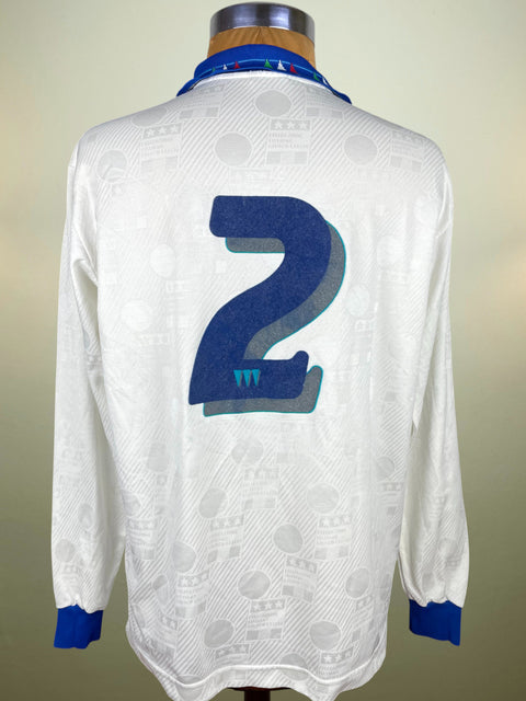 White Italy 1993 Away jersey with Antonio Benarrivo's number 2 in blue flock material on a mannequin against a neutral background