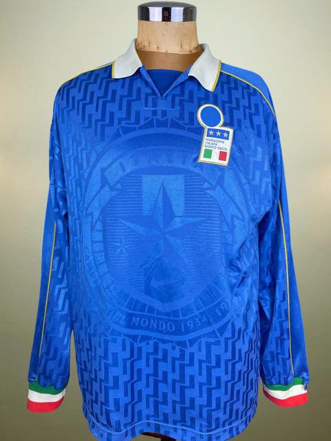 Blue Nike 1995 Italy jersey with a prominent emblem on a mannequin against a neutral background