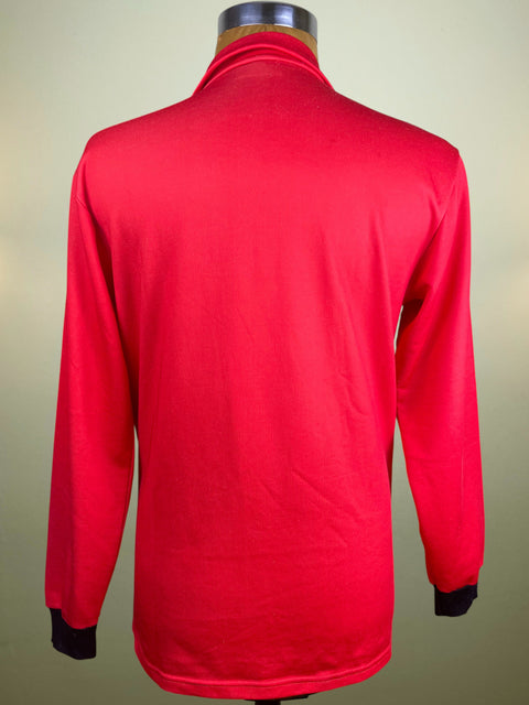 Red long-sleeve shirt on a mannequin against a beige background