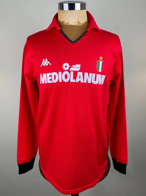 Red AC Milan 1988 Training jersey with 'Mediolanum' and Kappa logos on a mannequin against a gray background