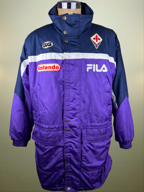 Purple and blue jacket with Nintendo and Fila brand logos on a neutral background