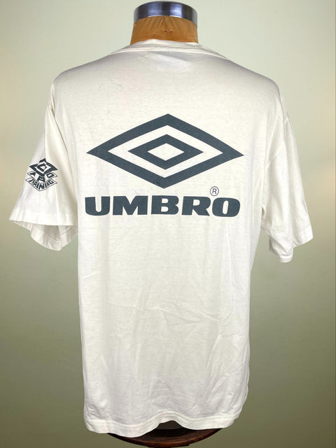 White t-shirt with Umbro logo on a mannequin against a plain background