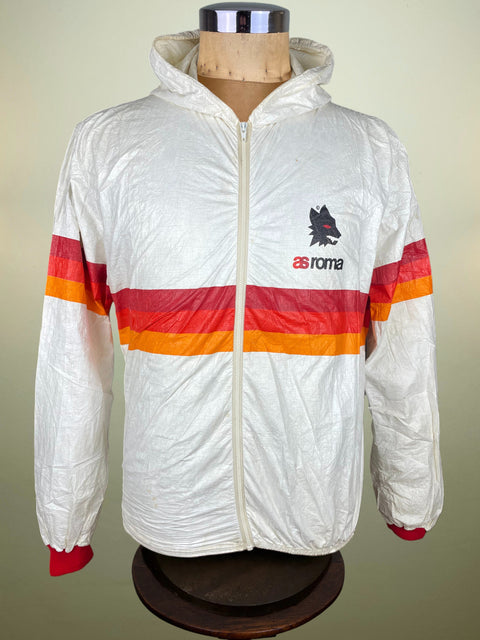 White 1979 Roma Waterproof jacket with red and orange stripes and the Lupetto on the chest on a mannequin against a beige background