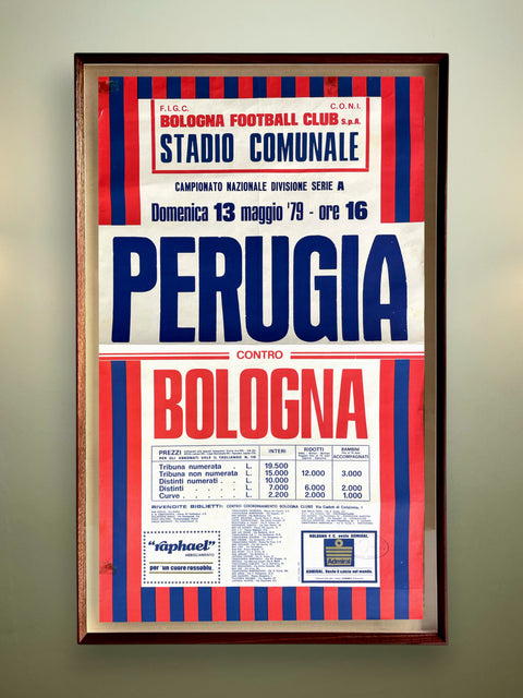 Framed vintage soccer match poster for Bologna Football Club against Perugia on a wall.