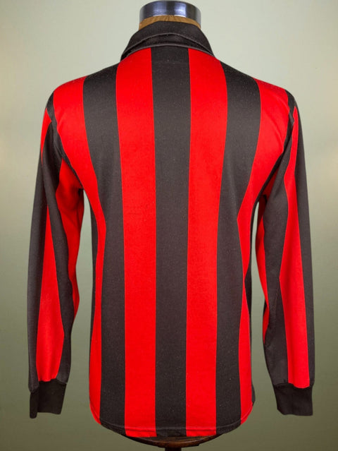 Red and black striped shirt on a mannequin against a plain background.