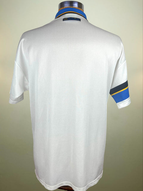 White Inter Milan 1997-98 Away jersey with blue and yellow accents on a mannequin against a beige background