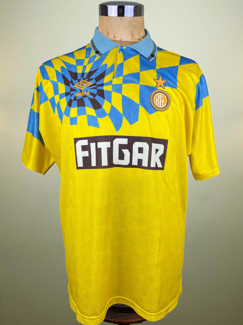 Yellow Inter Milan 1992 Umbro jersey with blue accents and Fitgar branding on a mannequin against a neutral background