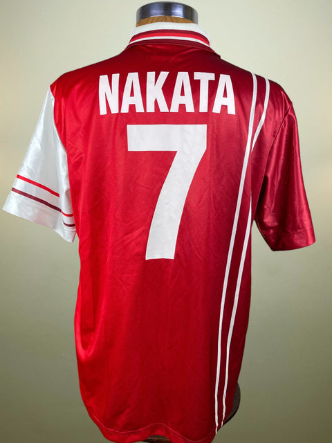 Red Perugia jersey with 'NAKATA' and number '7' on a beige background