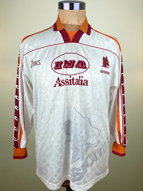 White AS Roma 1995-96 Away jersey with red and orange accents on a mannequin against a beige background