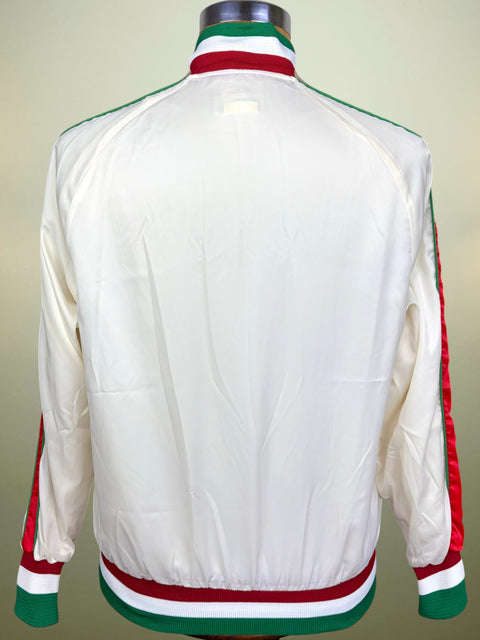 A white satin bomber jacket with green and red striped ribbed collar, cuffs, and hem, displayed on a mannequin from the back.