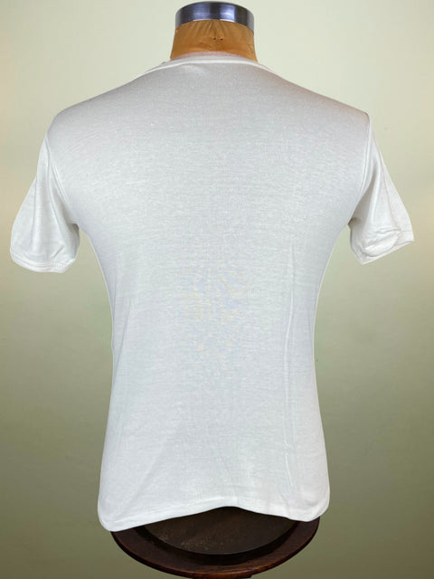 White t-shirt on a mannequin against a beige background