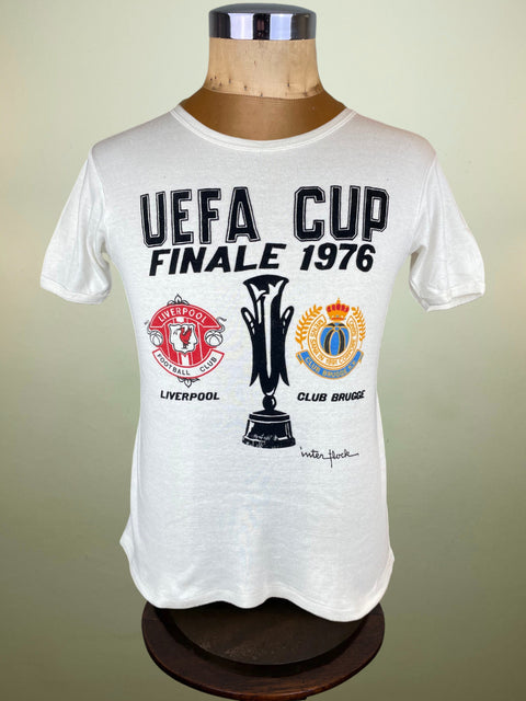 White t-shirt with UEFA Cup Finale 1976 design on a mannequin against a beige background