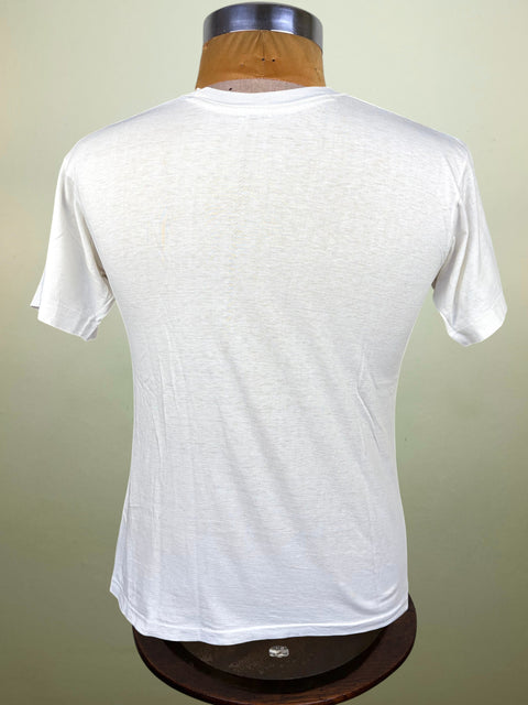 A white short-sleeve crewneck t-shirt displayed on a wooden dress form mannequin, viewed from the back against a light beige background.