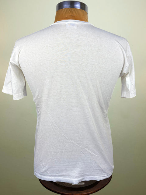 A white short-sleeve crewneck t-shirt displayed on a wooden dress form mannequin, viewed from the back against a light beige background.