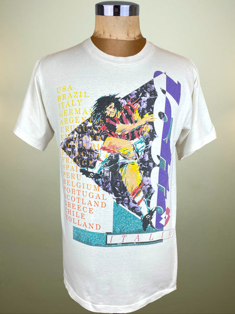 White t-shirt with colorful graphic design of Ruud Gullit in an AC Milan Shirt on a mannequin against a beige background