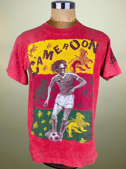 Red t-shirt with graphic design on a mannequin against a beige background