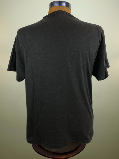 Black t-shirt on a mannequin against a plain background