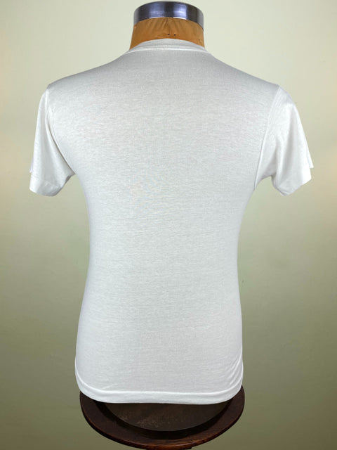 White t-shirt on a mannequin against a plain background