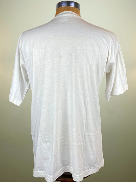 White t-shirt on a mannequin against a plain background